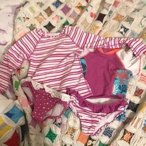 Two rash guards and 2 bottoms